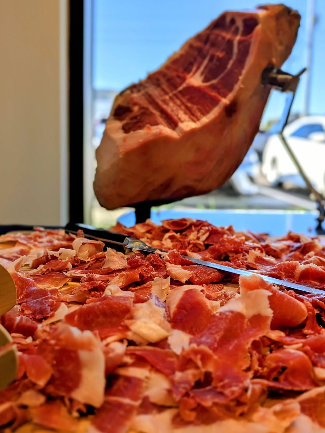Broadbent's Kentucky country ham hanging in traditional smokehouse in Kuttawa, Kentucky - 23-time Grand Champion dry-cured ham since 1909